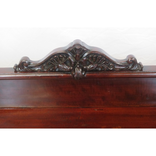 290 - Victorian mahogany three tier dumbwaiter with railed back, foliate carving, on scroll feet