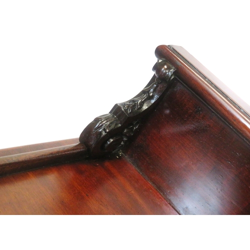 290 - Victorian mahogany three tier dumbwaiter with railed back, foliate carving, on scroll feet