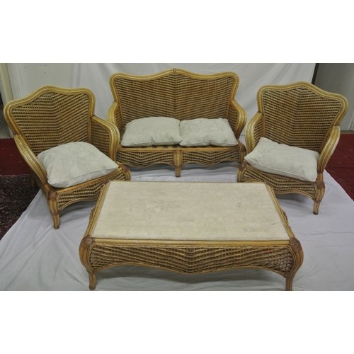 322 - Four piece cane & rattan conservatory or patio suite with serpentine backs, shaped legs, & table wit... 