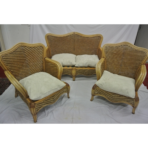 322 - Four piece cane & rattan conservatory or patio suite with serpentine backs, shaped legs, & table wit... 