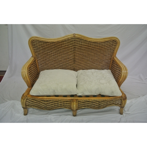 322 - Four piece cane & rattan conservatory or patio suite with serpentine backs, shaped legs, & table wit... 