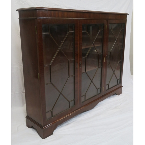 65 - Edwardian style mahogany bookcase with astragal glazed doors, adjustable shelving, on bracket feet