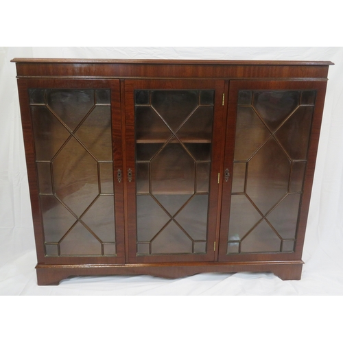 65 - Edwardian style mahogany bookcase with astragal glazed doors, adjustable shelving, on bracket feet