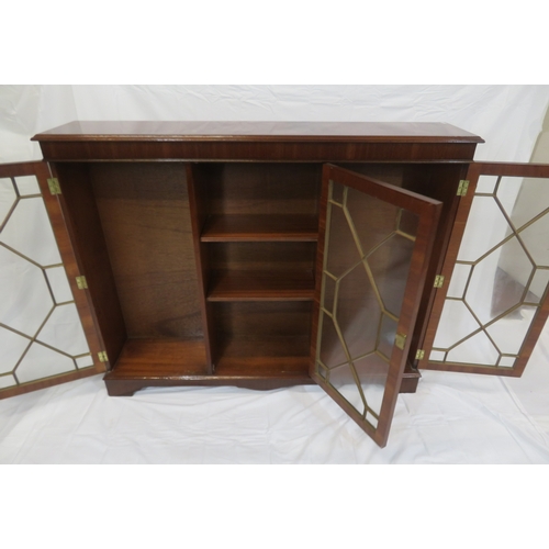 65 - Edwardian style mahogany bookcase with astragal glazed doors, adjustable shelving, on bracket feet