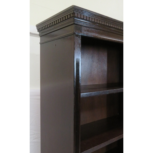 70 - Edwardian style tall bookcase with dentil frieze, adjustable shelving, on bracket feet