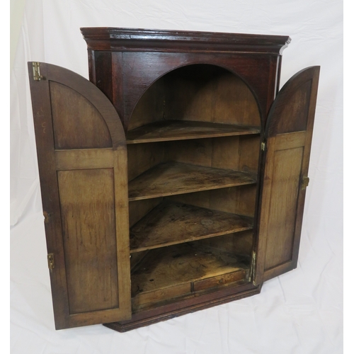 86 - Georgian style mahogany corner press with domed doors & shelved interior