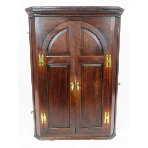 86 - Georgian style mahogany corner press with domed doors & shelved interior