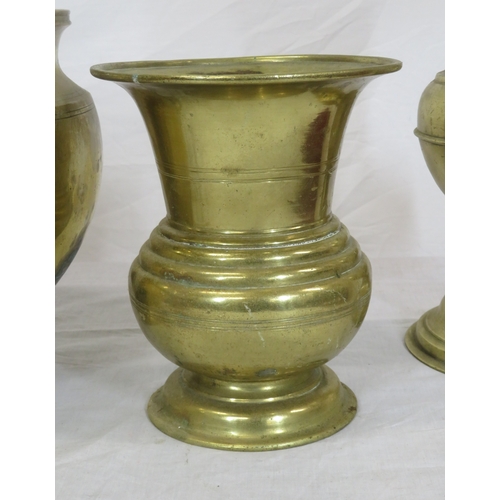 88 - Four brass vases, stand, etc