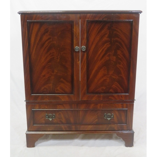 90 - Edwardian style mahogany press or TV cabinet with panelled doors, drawer under with drop handles, on... 