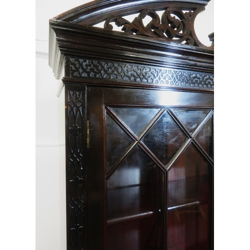 95 - Edwardian mahogany bookcase with domed pierced pediment, astragal glazed doors with shelved interior... 