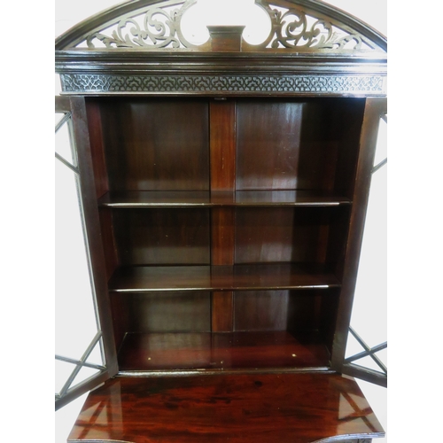 95 - Edwardian mahogany bookcase with domed pierced pediment, astragal glazed doors with shelved interior... 