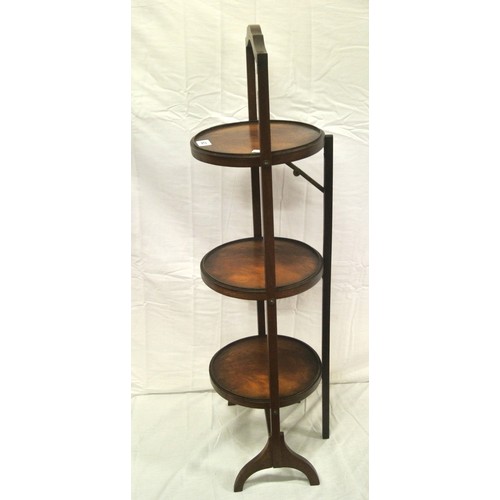 63 - Edwardian mahogany three tier round adjustable plate stand with shaped legs