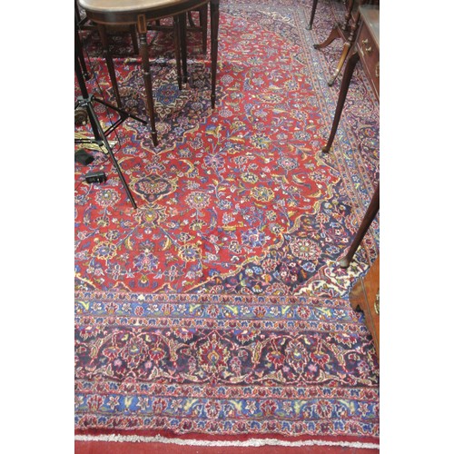 214 - Fine hand woven rich red and blue ground Persian Kashan carpet of traditional design 382 x 290cm