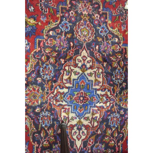 214 - Fine hand woven rich red and blue ground Persian Kashan carpet of traditional design 382 x 290cm