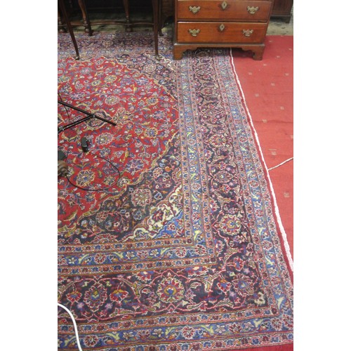 214 - Fine hand woven rich red and blue ground Persian Kashan carpet of traditional design 382 x 290cm