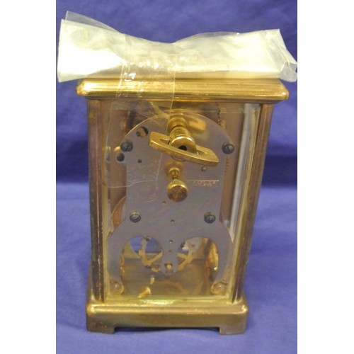 303 - Schatz brass cased German carriage clock with shaped handle