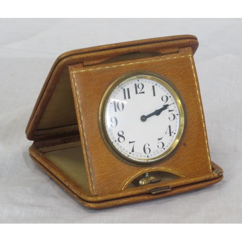 304 - Leather cased folding travel clock with brass frame dial