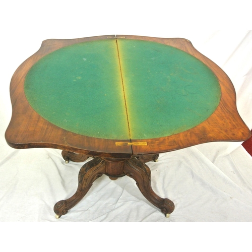 195 - Victorian walnut card table with serpentine shaped sides, swivel fold-over top, with press under, on... 