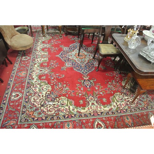 276 - Large multi coloured field Persian Tabriz carpet with rich colours on a floral field 380x290cm