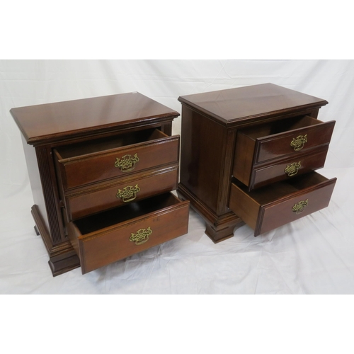 101 - Pair of mahogany side chests of three drawers with brass drop handles & pierced escutcheons, on brac... 