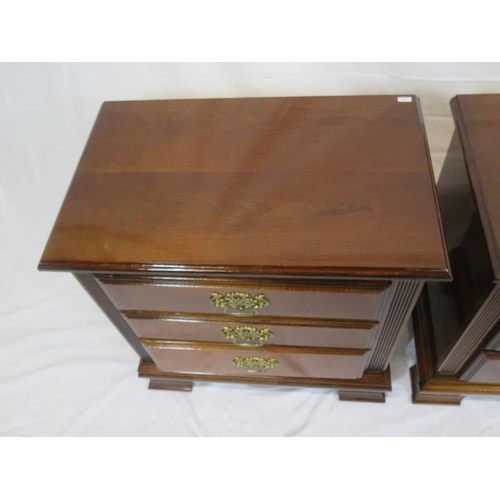 101 - Pair of mahogany side chests of three drawers with brass drop handles & pierced escutcheons, on brac... 