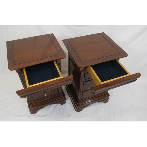 116 - Pair of mahogany bedside chests of three drawers each, with round handles, on carved bracket feet