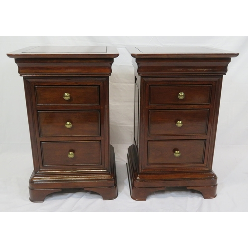 116 - Pair of mahogany bedside chests of three drawers each, with round handles, on carved bracket feet