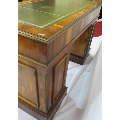 120 - Edwardian style yew kneehole desk with three frieze drawers, six side drawers, brass drop handles, o... 