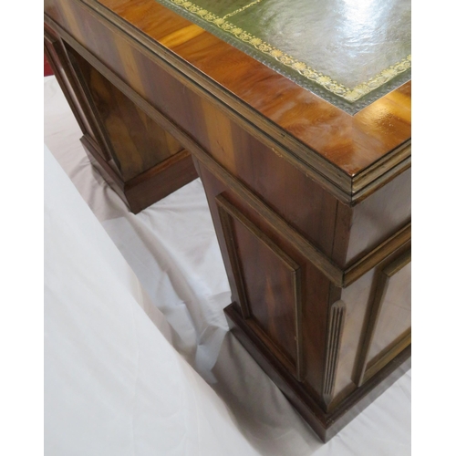 120 - Edwardian style yew kneehole desk with three frieze drawers, six side drawers, brass drop handles, o... 