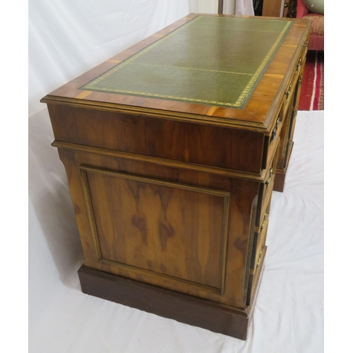 120 - Edwardian style yew kneehole desk with three frieze drawers, six side drawers, brass drop handles, o... 