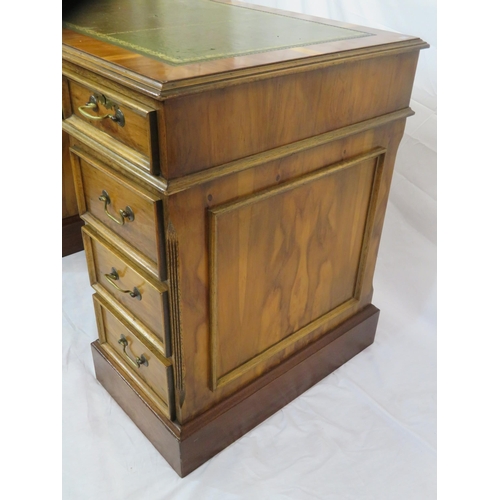 120 - Edwardian style yew kneehole desk with three frieze drawers, six side drawers, brass drop handles, o... 