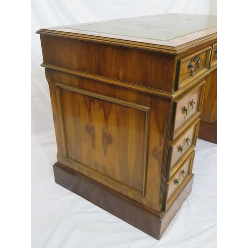 120 - Edwardian style yew kneehole desk with three frieze drawers, six side drawers, brass drop handles, o... 