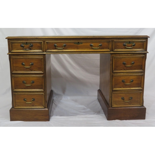 120 - Edwardian style yew kneehole desk with three frieze drawers, six side drawers, brass drop handles, o... 