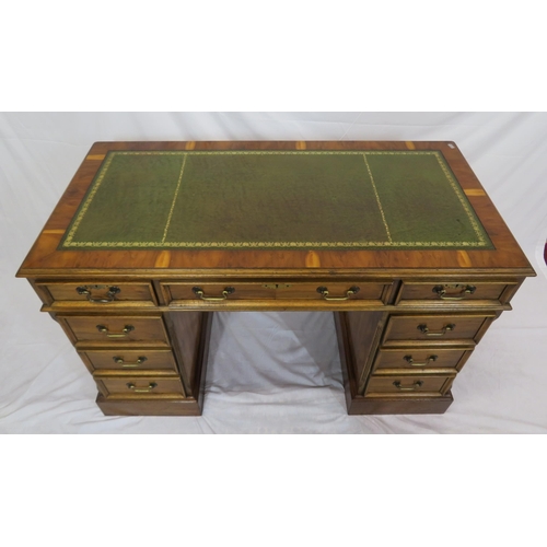 120 - Edwardian style yew kneehole desk with three frieze drawers, six side drawers, brass drop handles, o... 