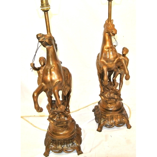 128 - Pair of Victorian style Spelter Marley horse & figure decorated electric table lamps with ornate bas... 