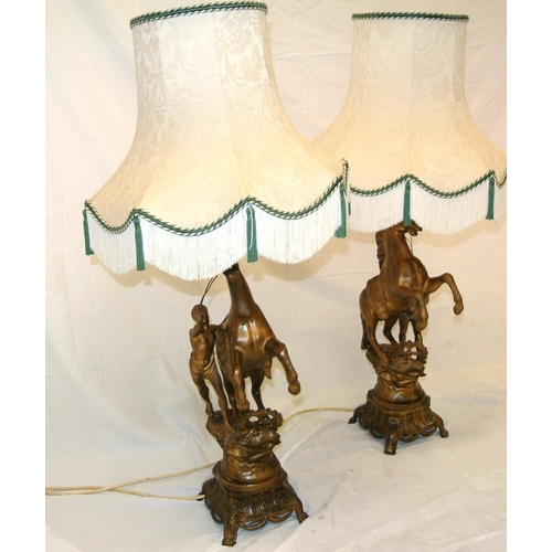 128 - Pair of Victorian style Spelter Marley horse & figure decorated electric table lamps with ornate bas... 