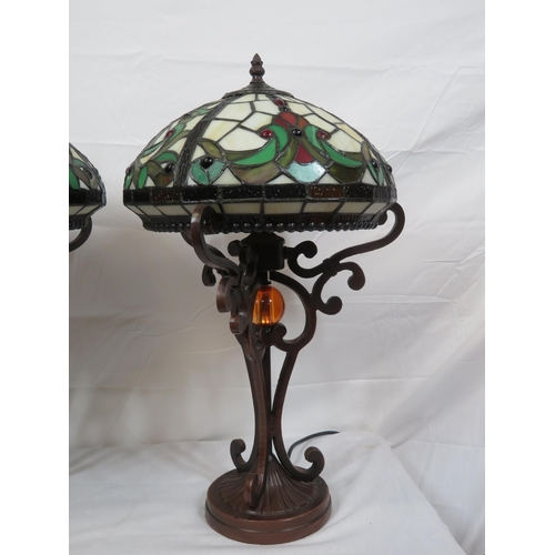 187 - Pair of Art Deco style electric table lamps with multi-coloured panelled shades, shaped columns & ro... 