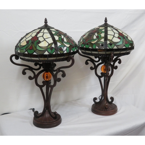 187 - Pair of Art Deco style electric table lamps with multi-coloured panelled shades, shaped columns & ro... 