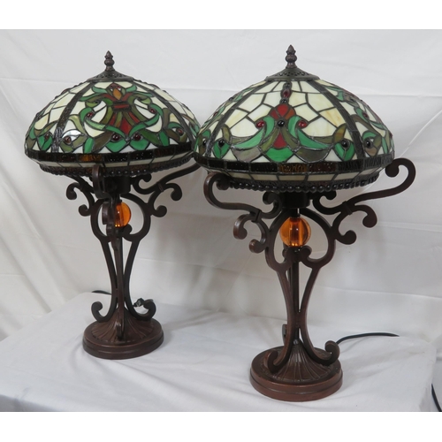 187 - Pair of Art Deco style electric table lamps with multi-coloured panelled shades, shaped columns & ro... 