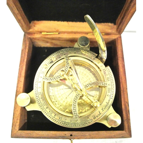 208 - Ornate brass compass with shaped gnomon, signed 'West, London' in presentation case