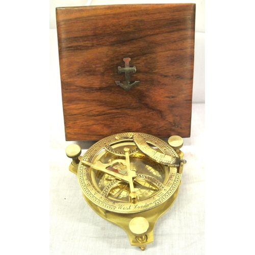 208 - Ornate brass compass with shaped gnomon, signed 'West, London' in presentation case