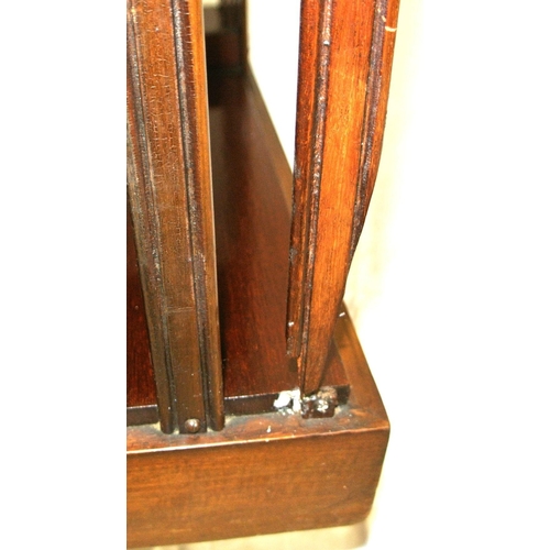 241 - Edwardian mahogany revolving bookcase with serpentine top, reeded rails, on quadrapod