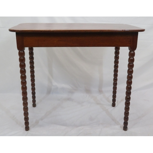 256 - Victorian mahogany oblong occasional table with rounded borders, raised on ball turned legs