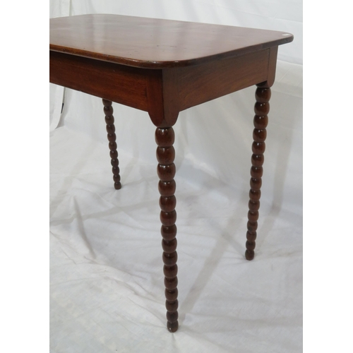 256 - Victorian mahogany oblong occasional table with rounded borders, raised on ball turned legs