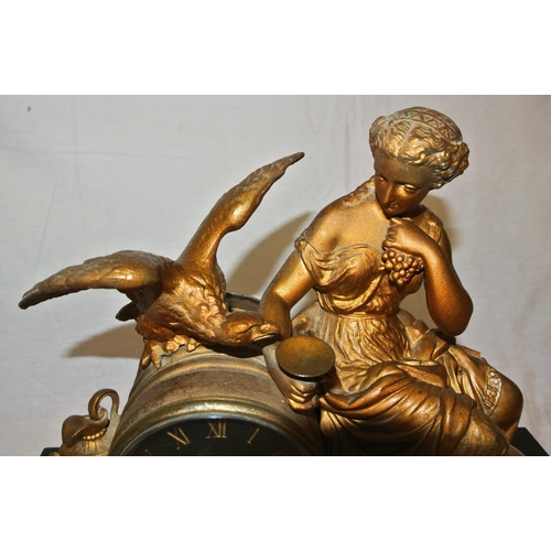 262 - French ormolu mantle clock with figure of a Lady with eagle & urn, circular brass framed dial, shape... 