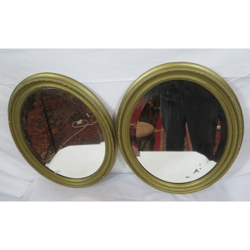 264 - Pair of Regency design oval bevelled glass wall mirrors with reeded & beaded decoration