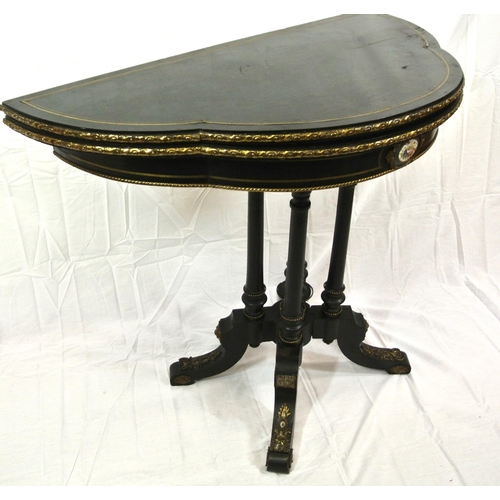 295 - Louis XV style inlaid ebonised card table of serpentine demi-lune form, with brass inlay, ormolu bor... 