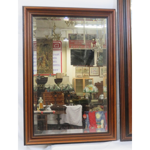 307 - Pair of mahogany framed bevelled glass wall mirrors with reeded borders