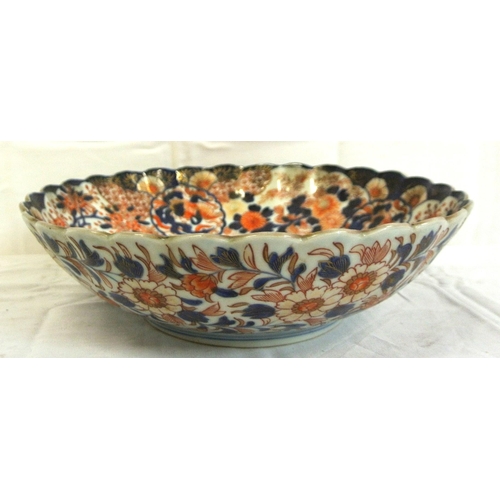 317 - Ornate Imari round bowl with scalloped rim, burnt ochre & deep blue foliate decoration