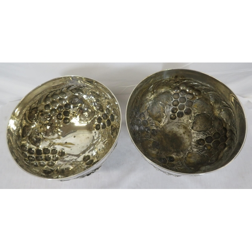 323 - Pair of round silverplated flower bowls with ornate grapevine embossing on spreading round bases